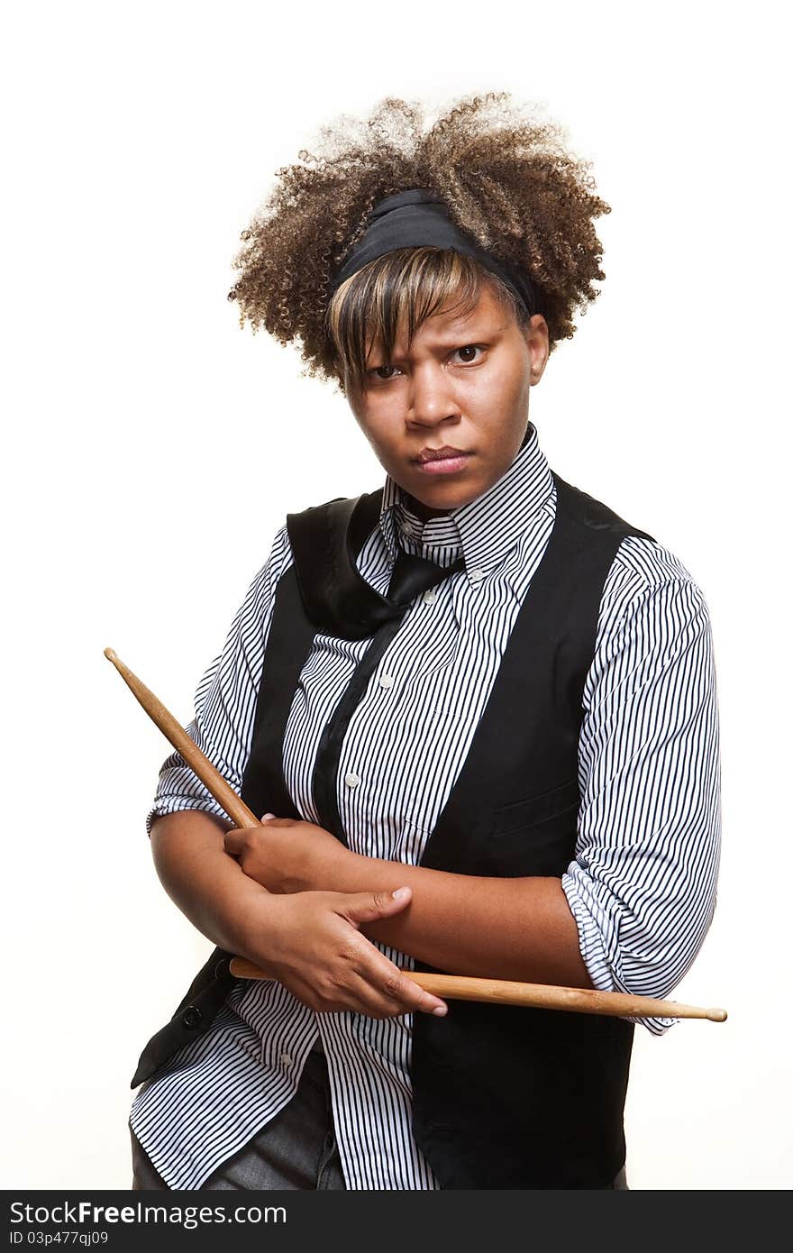 Young African girl poses with drumsticks against a white backgroundl. Young African girl poses with drumsticks against a white backgroundl