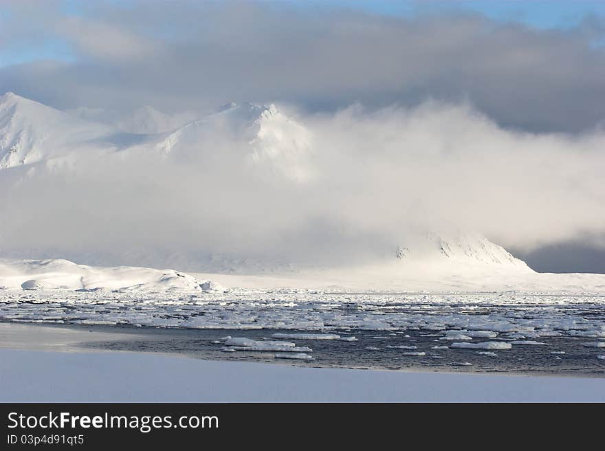 Arctic winter landscape - sea, glacier, mountains