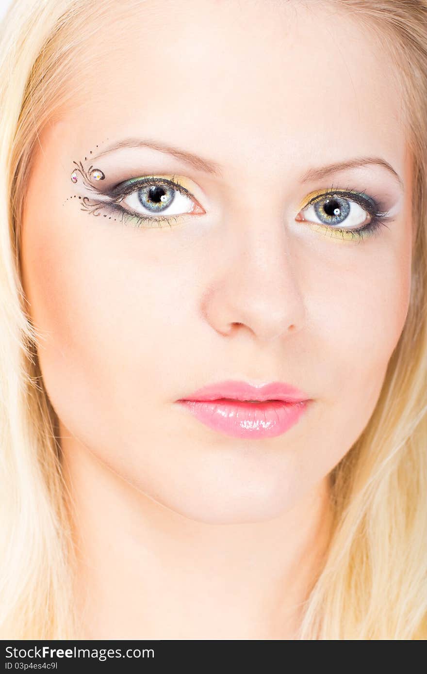 Young beautiful blonde woman with stylish make-up