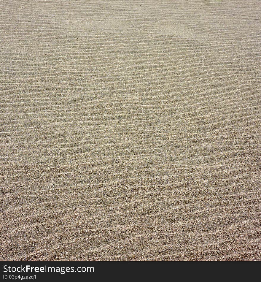 A square shot of beige sand