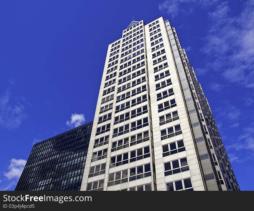 Modern Office Towers against a blue partly cloudy sky