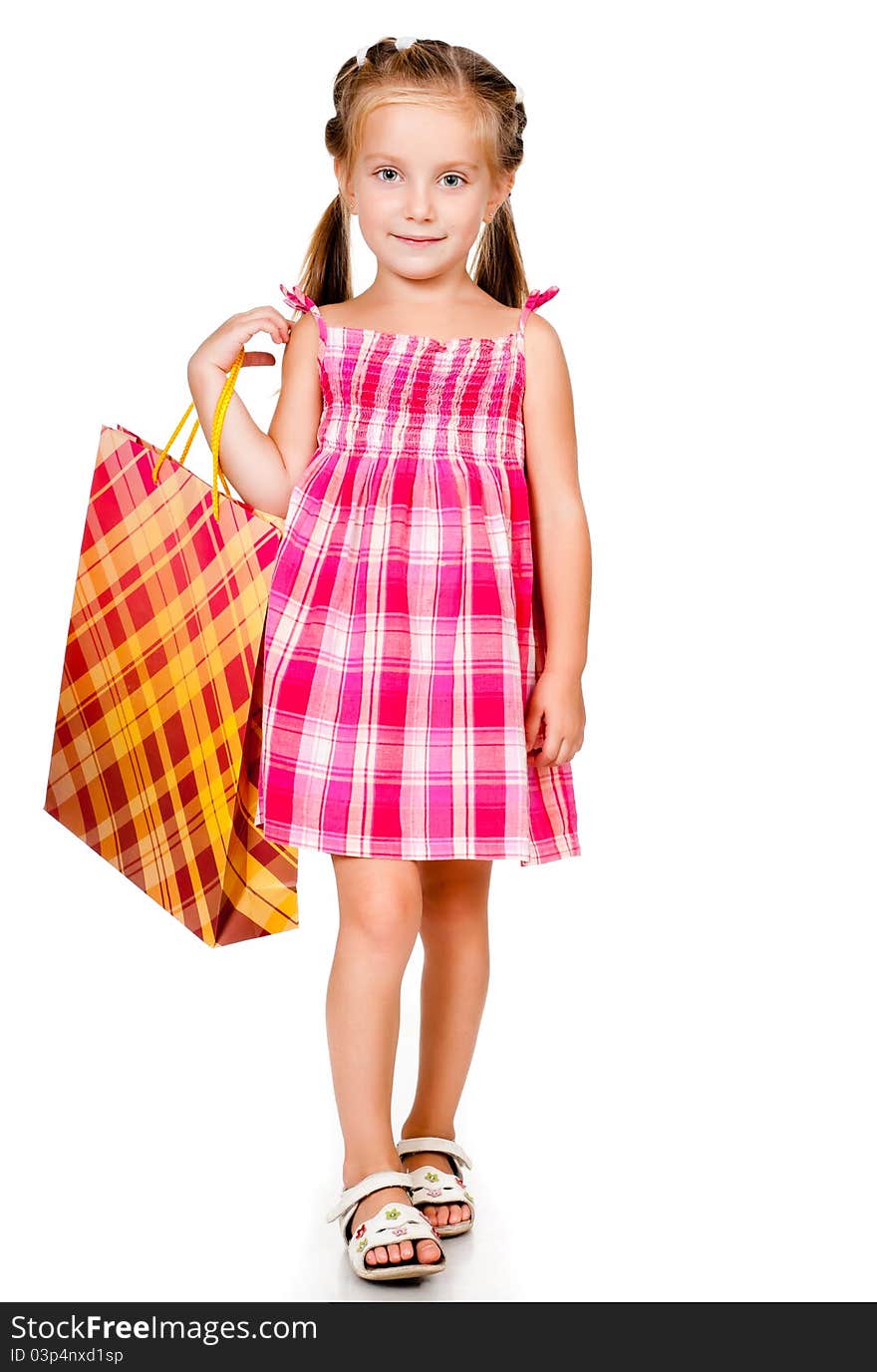 Little girl with the package isolated on a white background