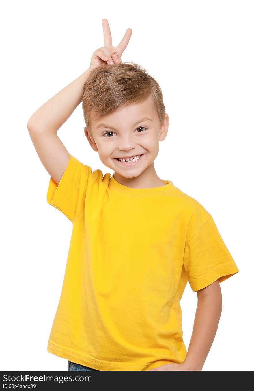 Portrait of little boy keeping two fingers above head over white background. Portrait of little boy keeping two fingers above head over white background