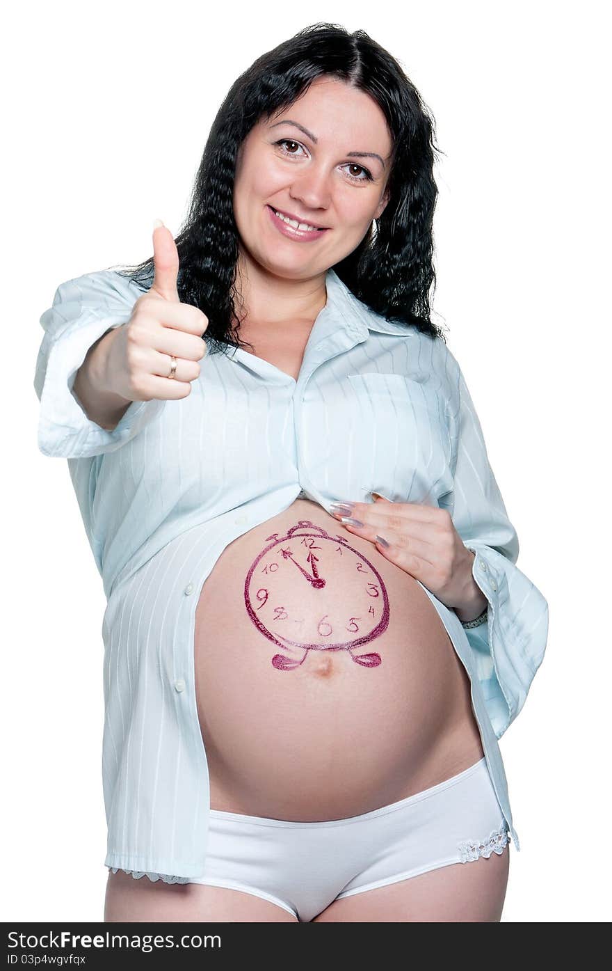 Tummy of pregnant woman with funny drawing over white background. Tummy of pregnant woman with funny drawing over white background