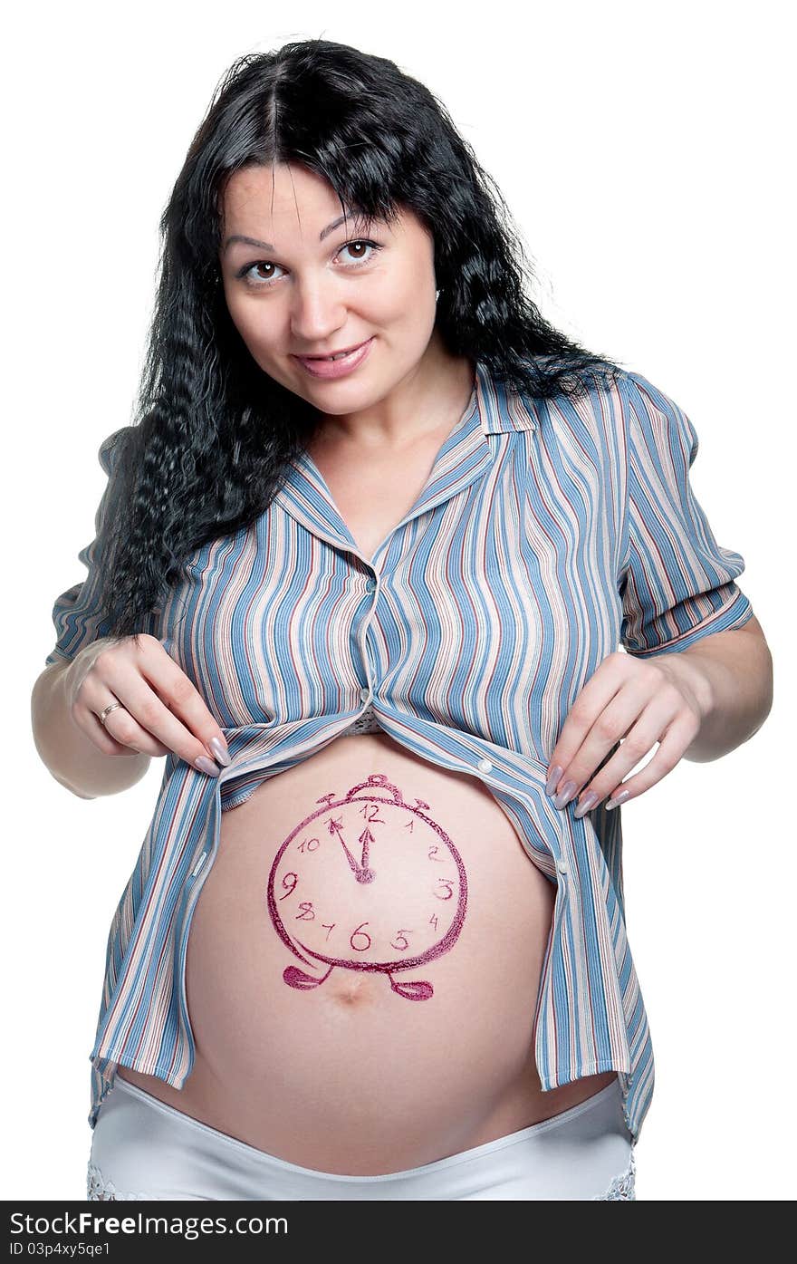 Tummy of pregnant woman with funny drawing over white background. Tummy of pregnant woman with funny drawing over white background