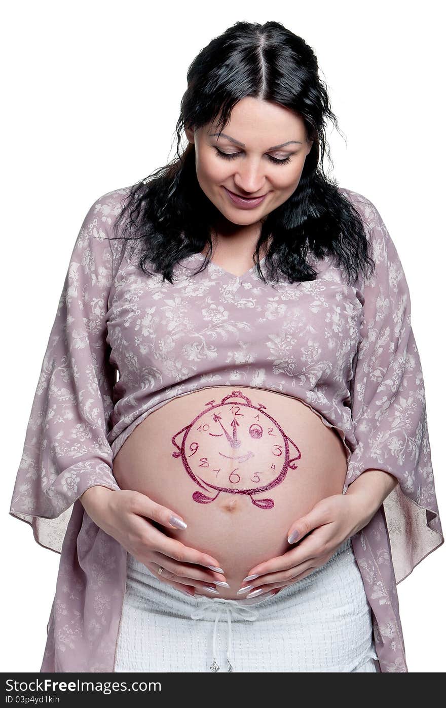 Tummy of pregnant woman with funny drawing over white background. Tummy of pregnant woman with funny drawing over white background