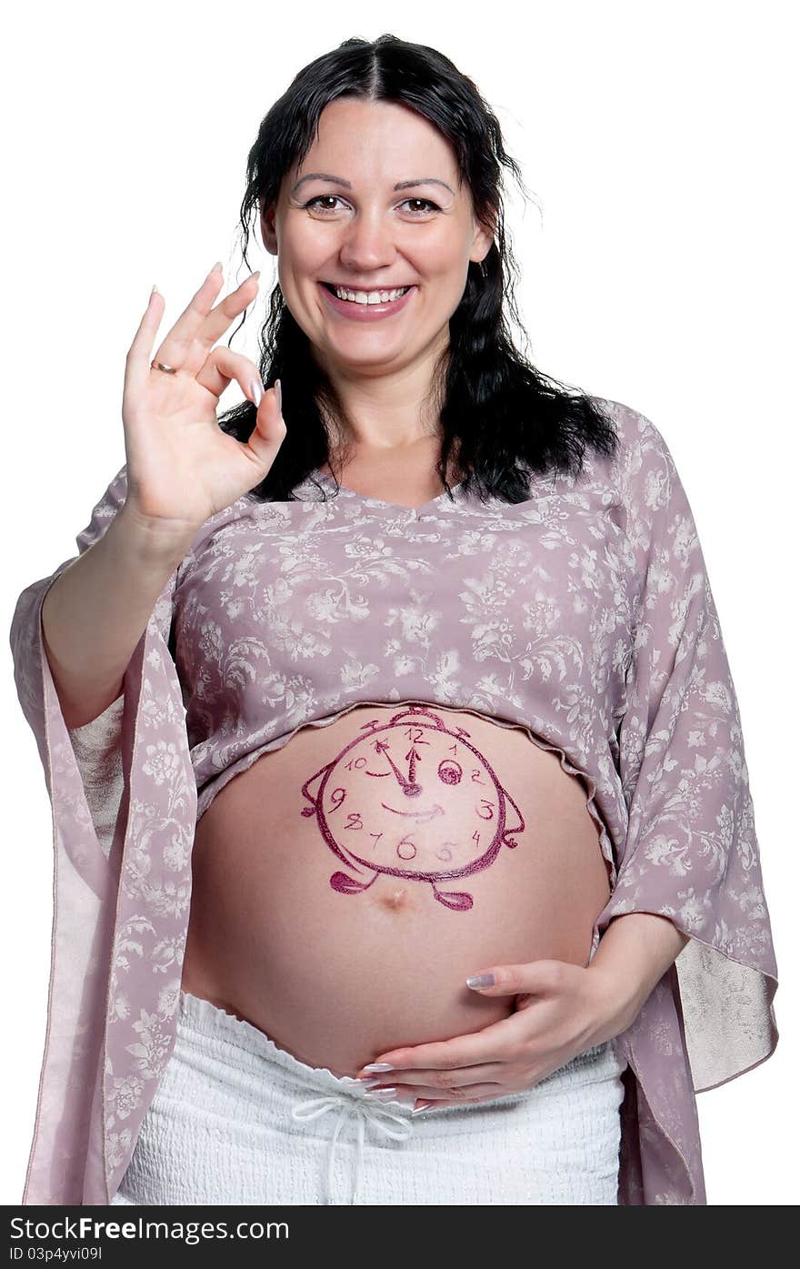 Tummy of pregnant woman with funny drawing over white background. Tummy of pregnant woman with funny drawing over white background