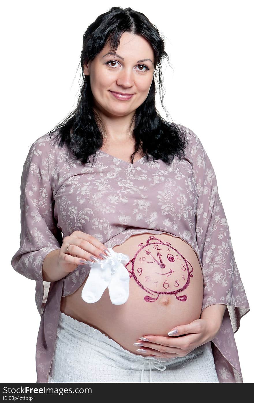 Tummy of pregnant woman with funny drawing over white background. Tummy of pregnant woman with funny drawing over white background