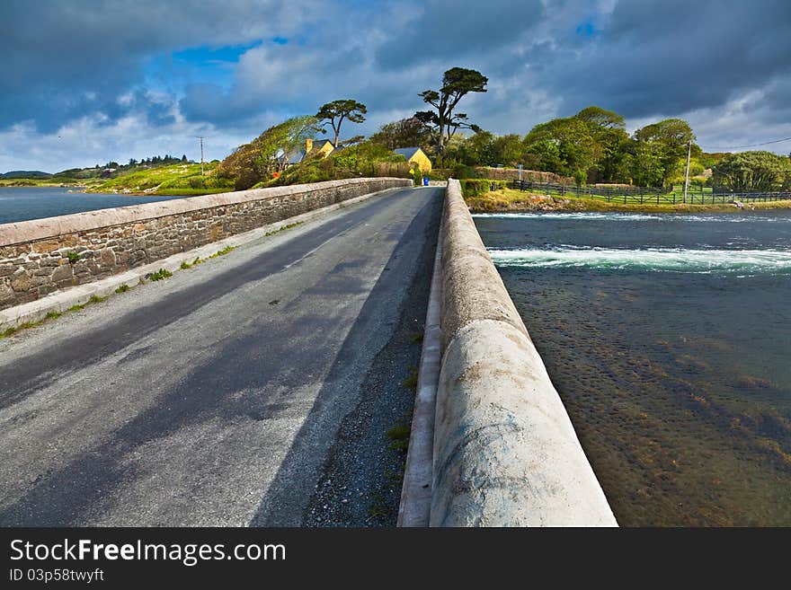 Bridge at Ardmore bay during high tide, county Galway, Ireland.