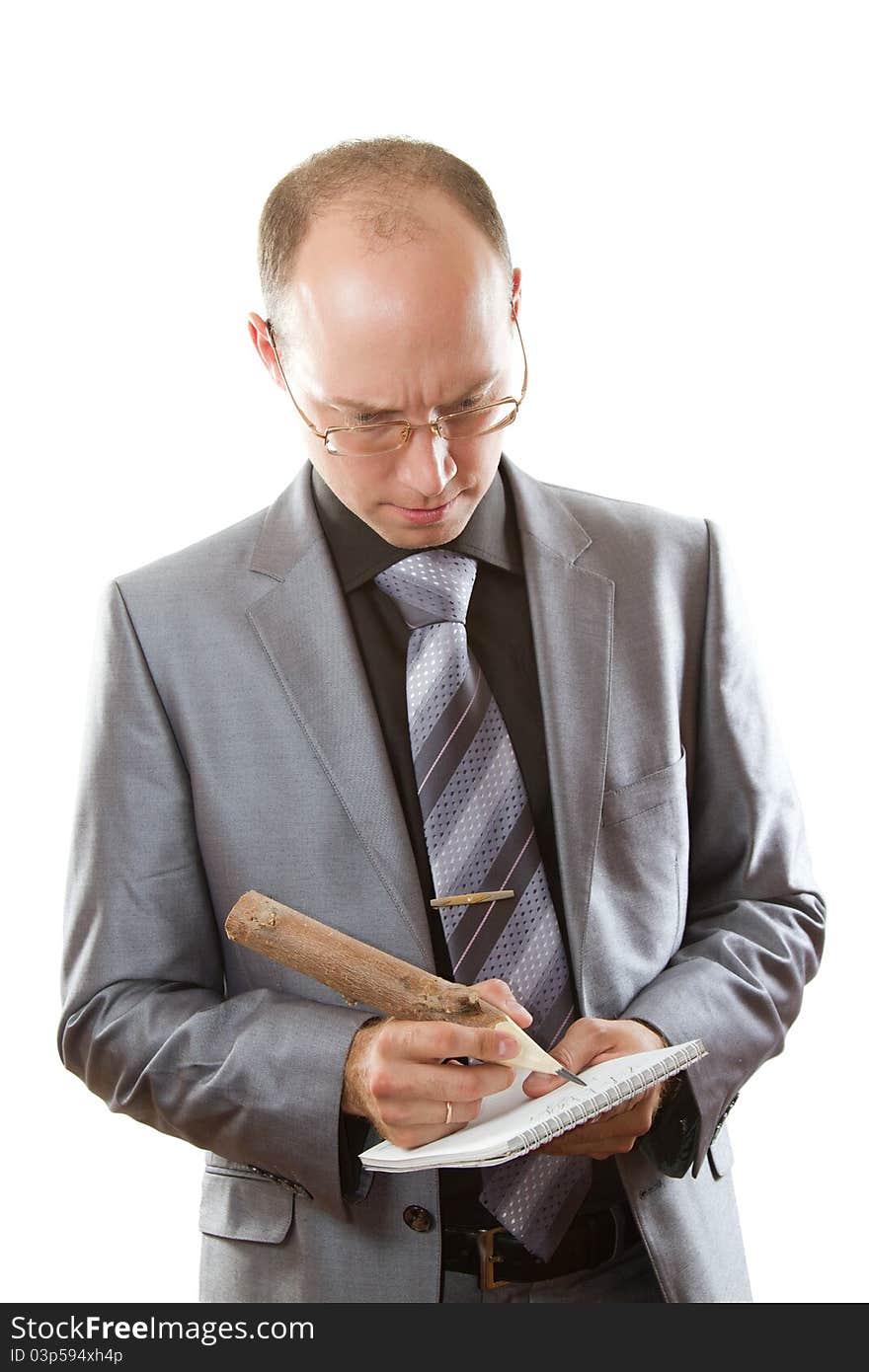 Man in a gray business suit, tie and glasses holding office supplies on an isolated white background. Man in a gray business suit, tie and glasses holding office supplies on an isolated white background