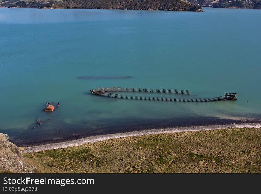 The rusting hulk of a shipwrecks lie off the coast of Quail Island, New Zealand. The rusting hulk of a shipwrecks lie off the coast of Quail Island, New Zealand.