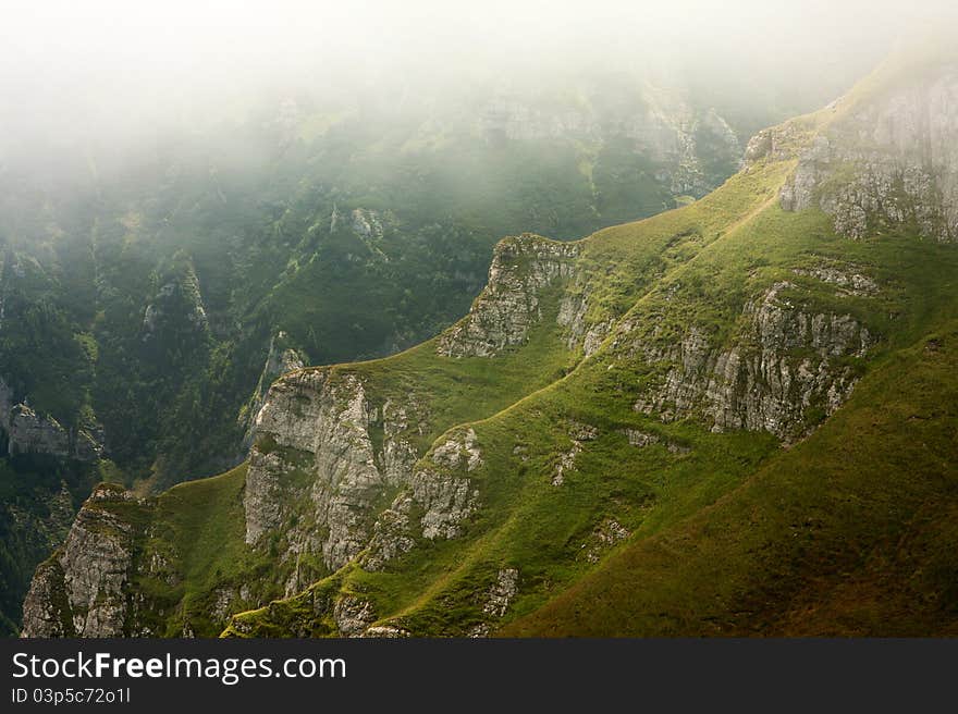 Mountain valley in the mist, Bucegi Mountains, Romania