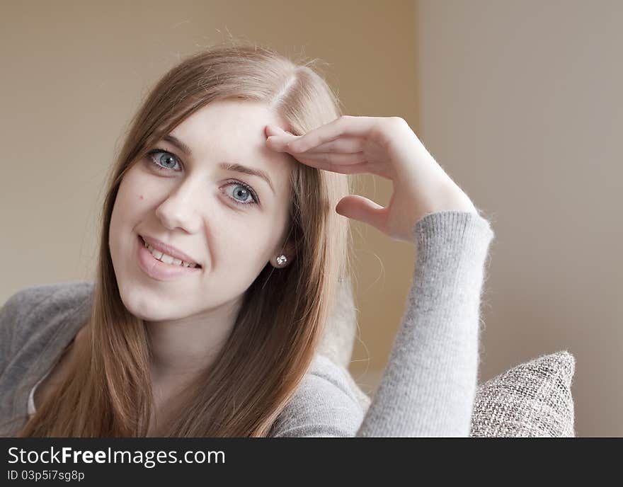 Beautiful young woman sitting on the bed. Beautiful young woman sitting on the bed