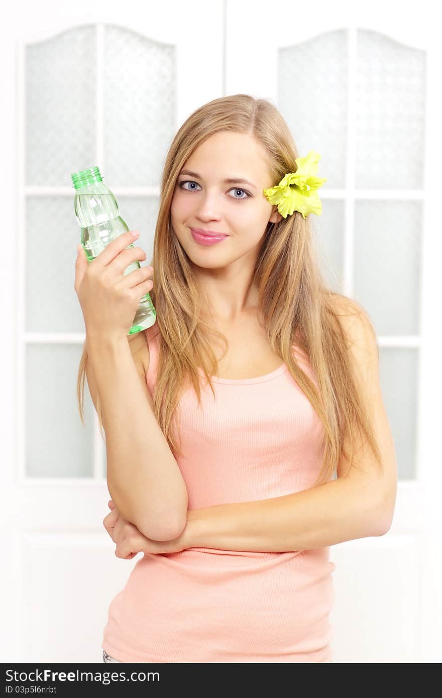 Beautiful girl with bottle of water