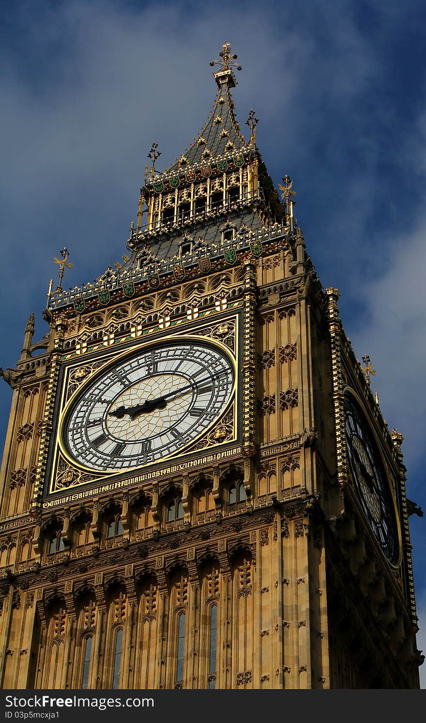 A view of the summit of the world's most famous clock in a blue August sky. A view of the summit of the world's most famous clock in a blue August sky