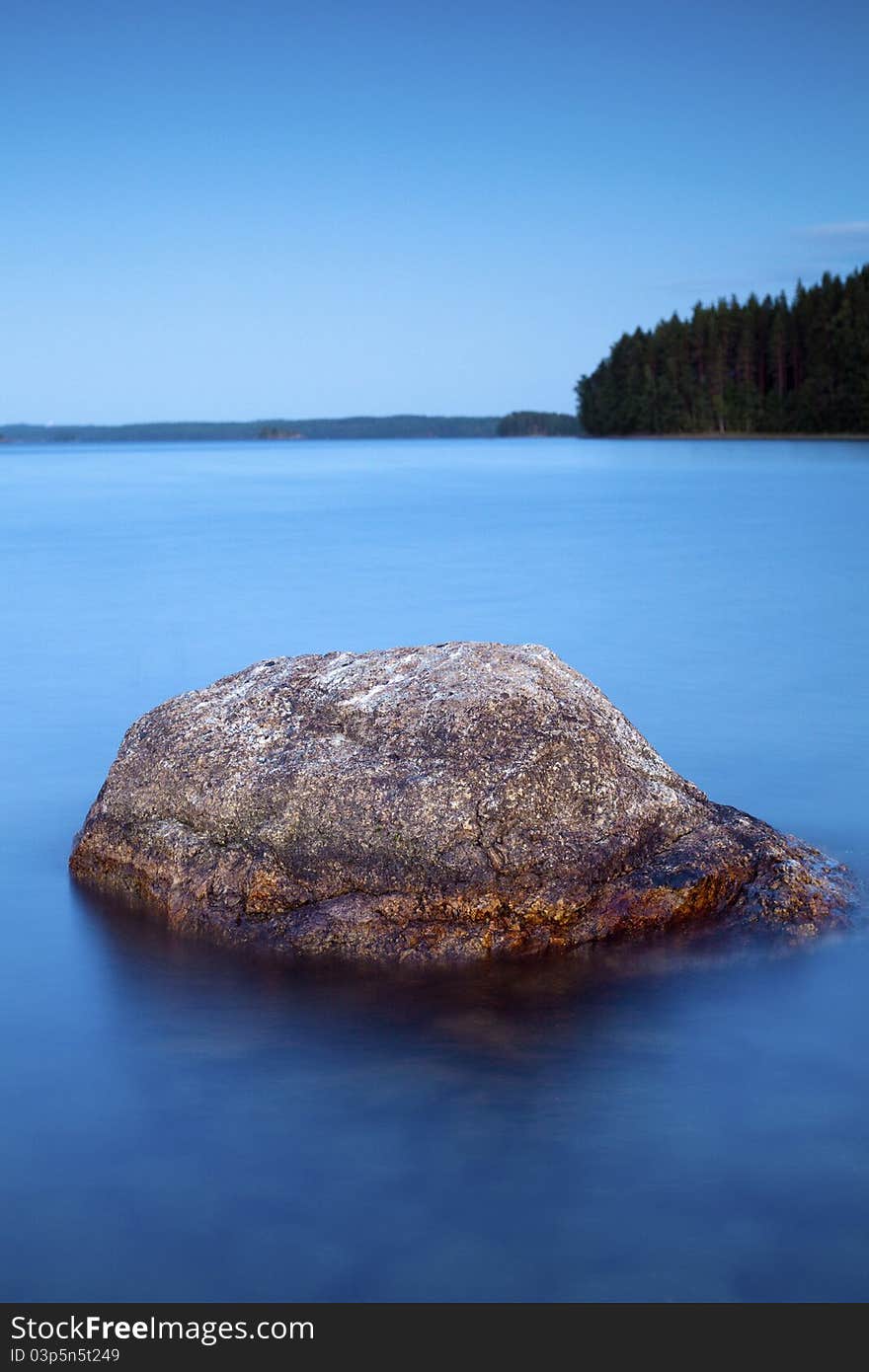 Lake's shore - Coastal stones at twilight. Lake's shore - Coastal stones at twilight