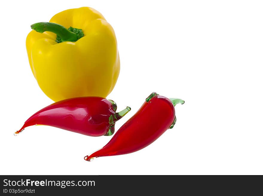 Natural yellow bell pepper and two glass red chili (chilli, chilly, chile) pepper isolated on white background. Natural yellow bell pepper and two glass red chili (chilli, chilly, chile) pepper isolated on white background.