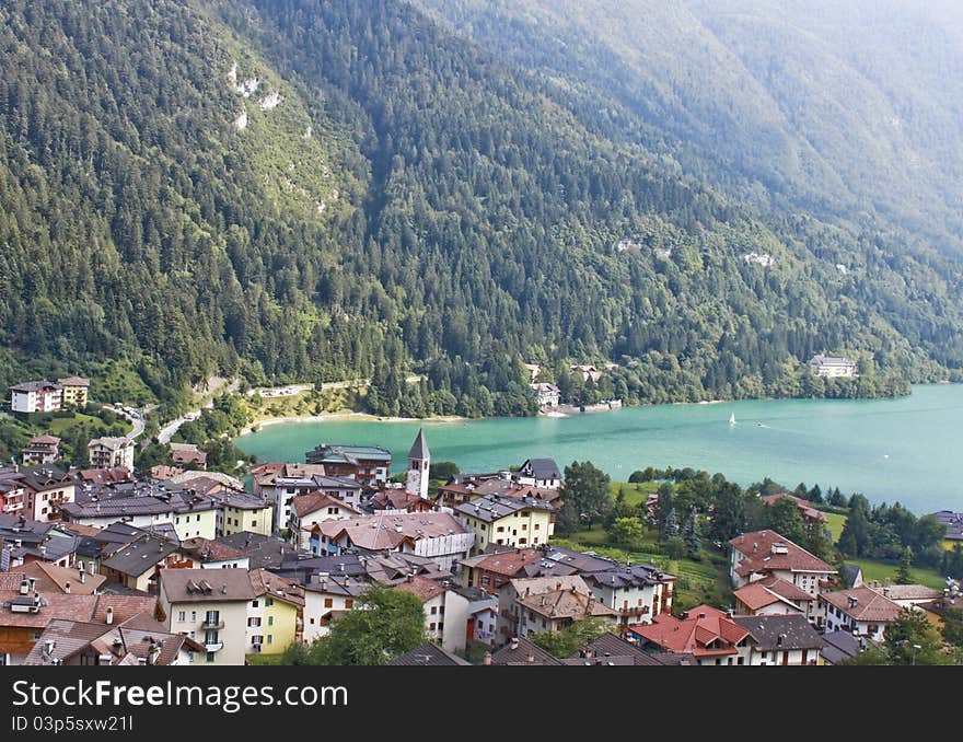 Mountain view with a lake and a typical little city in the northern of Italy. Mountain view with a lake and a typical little city in the northern of Italy.