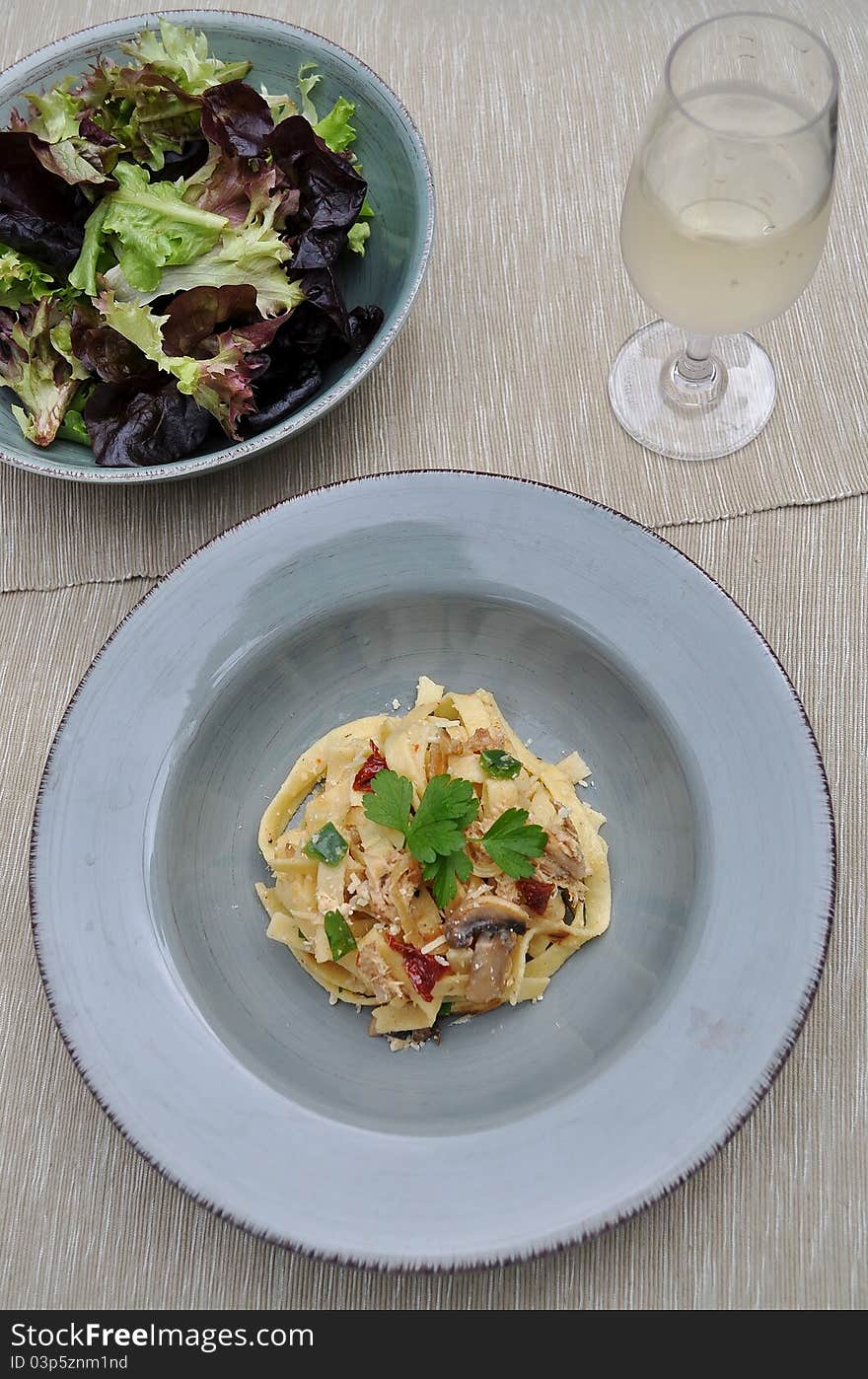 Fettucine Pasta With Salad And Wine