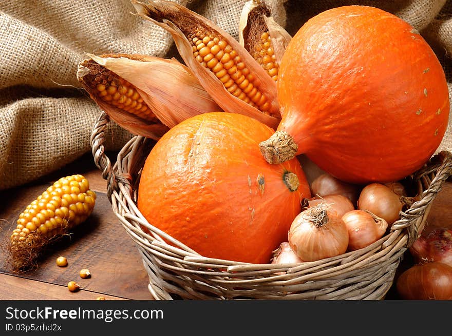 Fall basket full of pumpkins and vegetables. Fall basket full of pumpkins and vegetables