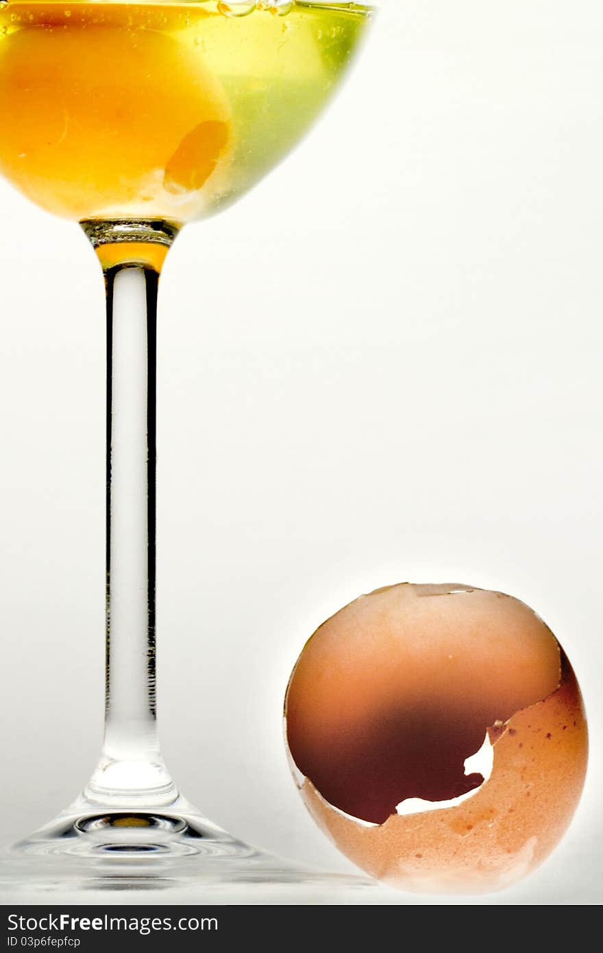 Egg in the glass and broken shell