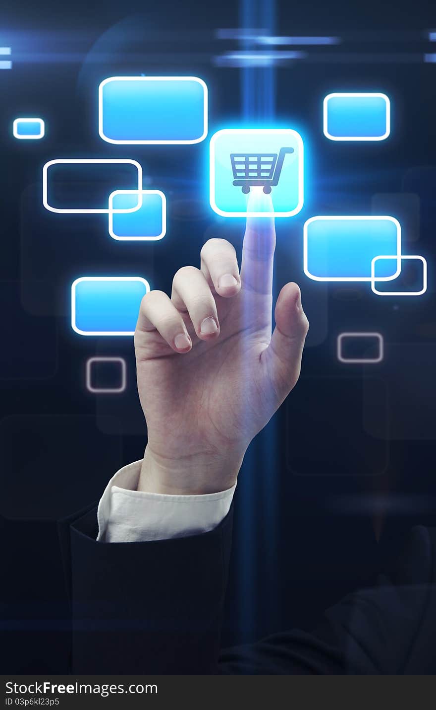 Hand pushing a trolley touchscreen button on a touch screen interface. Hand pushing a trolley touchscreen button on a touch screen interface