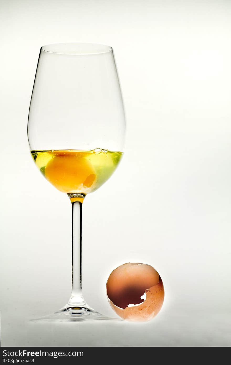 Egg in the glass and broken shell