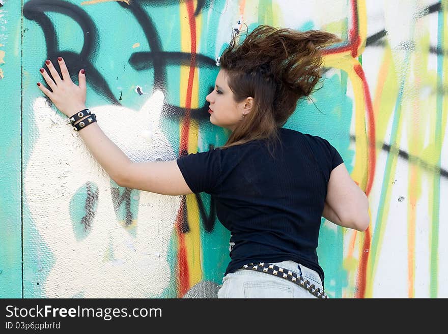 Punk girl walking outdoor in city