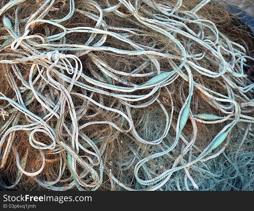 Details of fishing nets in close view in a fishermen port