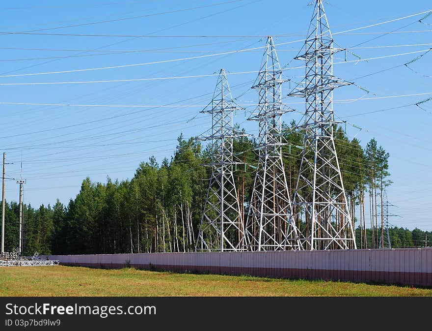 Three metal support of transmission lines of an electricity