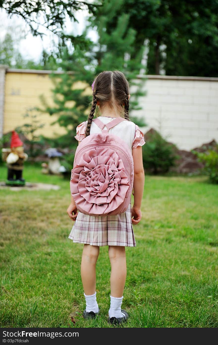 Young Girl With Pink Backpack Ready For School