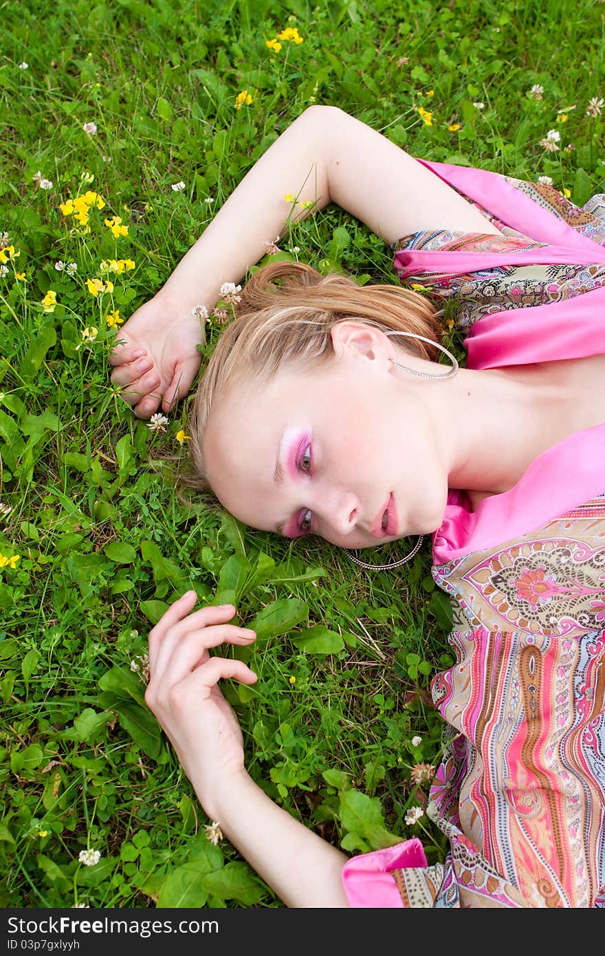 Portrait of a beautiful  woman on the meadow, summer