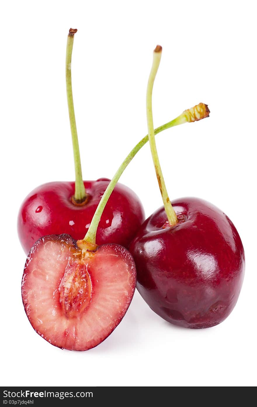 Close up view of three cherries over white background. Close up view of three cherries over white background