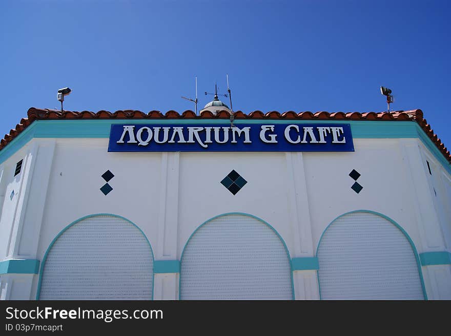 An aquarium and cafe at the end of a pier on the west coast of America.