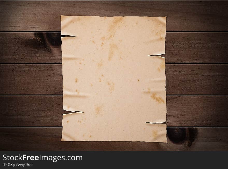 Old yellow paper on wooden wall, clipping path. Old yellow paper on wooden wall, clipping path.