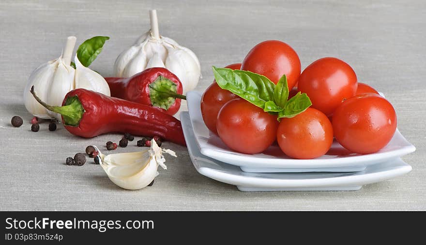 Fresh vegetables and spices lying on a table. Fresh vegetables and spices lying on a table