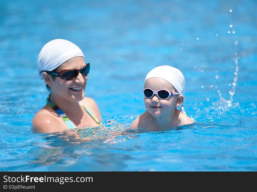 Mother And Baby Are Swimming In Swimming Pool