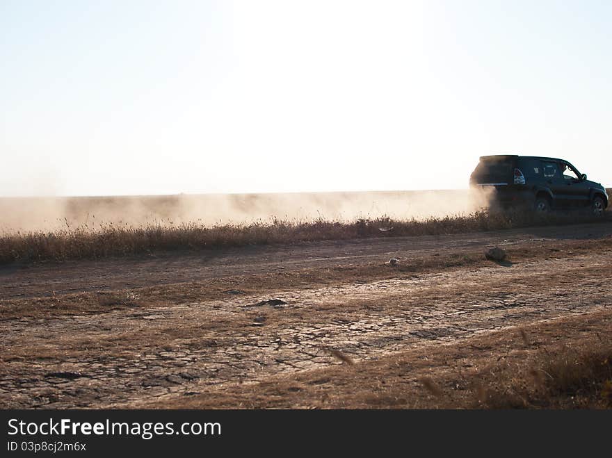 Outlander driving offroad in desert road