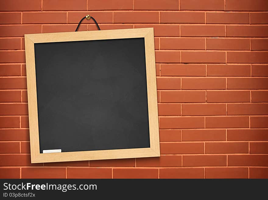 Blackboard On Orange Wall Background