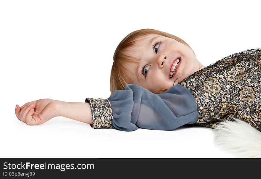 Little Girl Lying On The Floor In The Studio