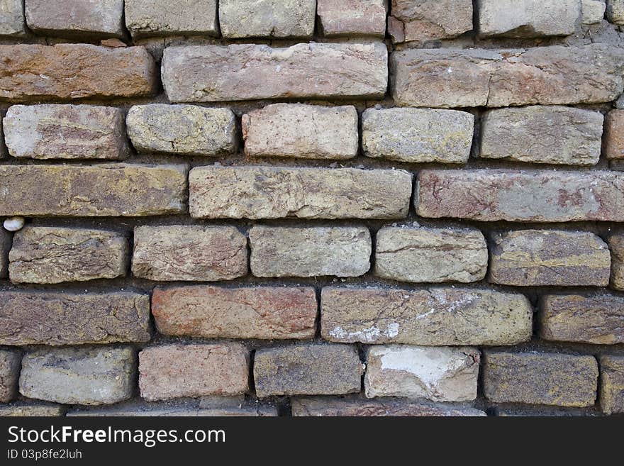 Old and damaged brick wall. Old and damaged brick wall