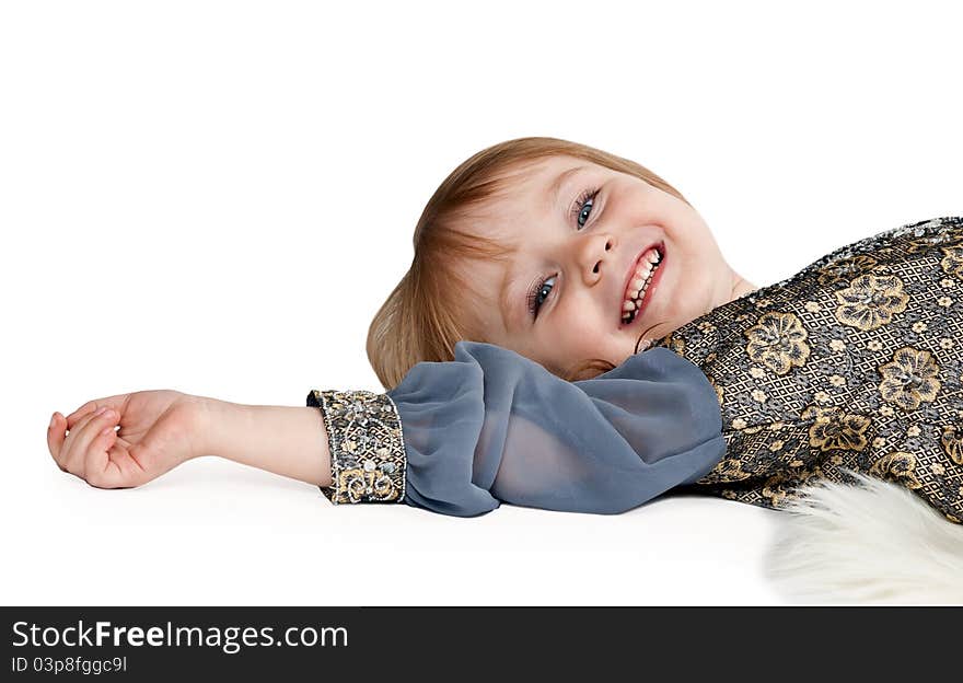 Little Girl Lying On The Floor In The Studio