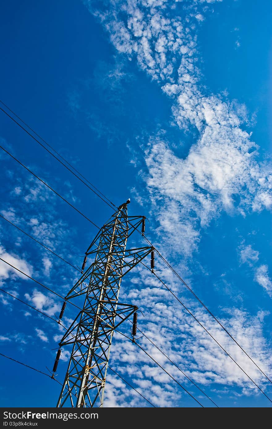 Electric mast in the field at sunny weather