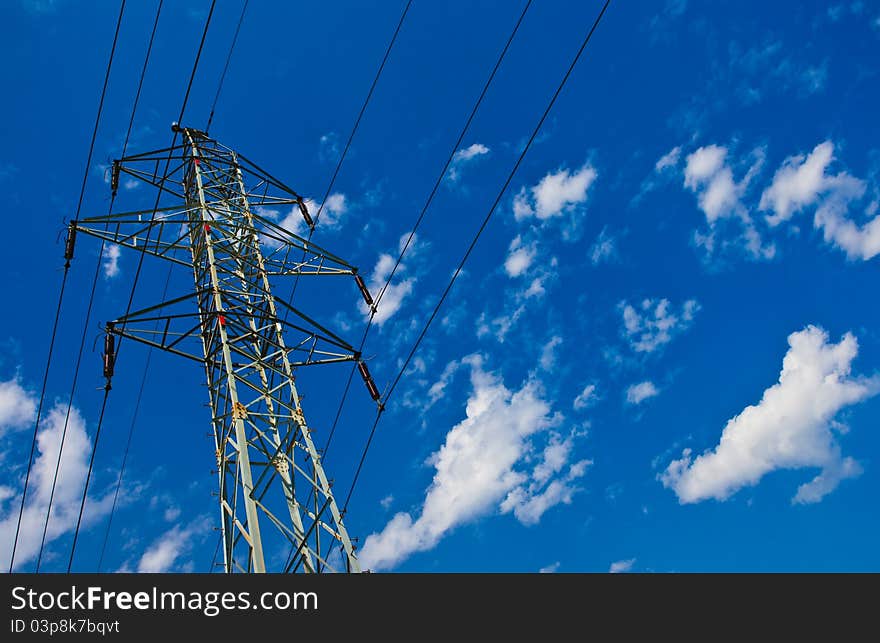 Electric mast in the field at sunny weather