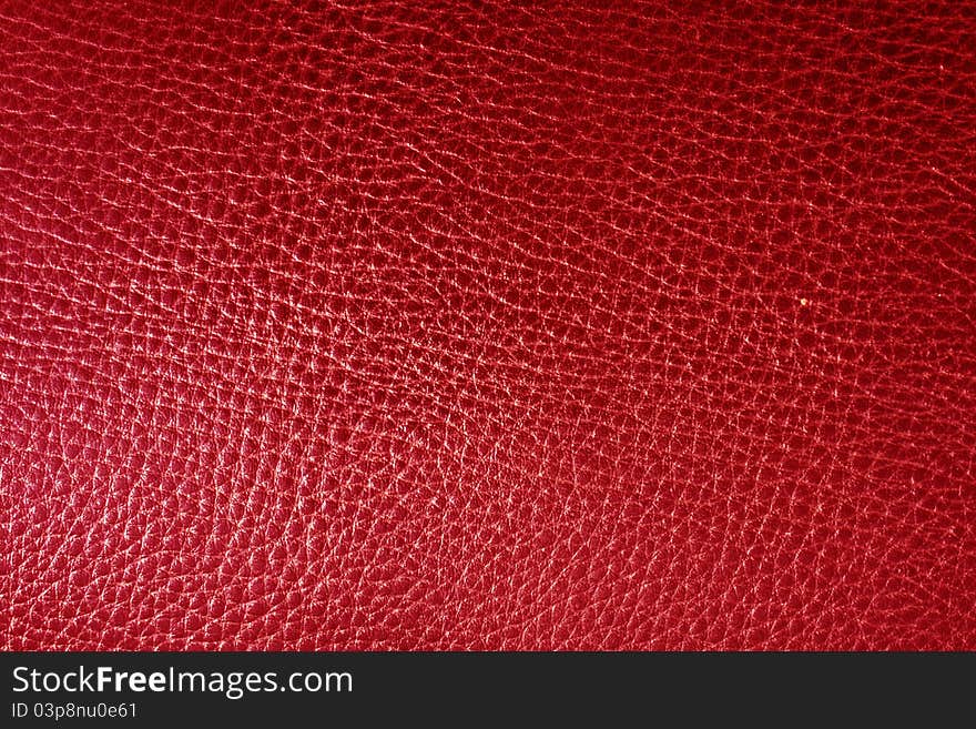 Red leather texture closeup. Useful as background for design-works. Red leather texture closeup. Useful as background for design-works.