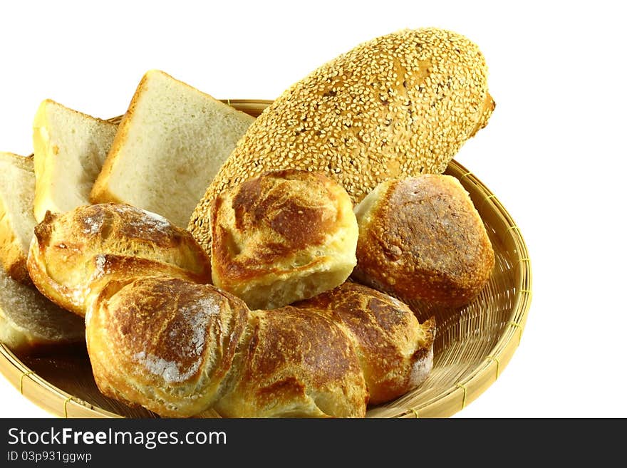 Stack of sliced whole wheat bread on isolated white background.