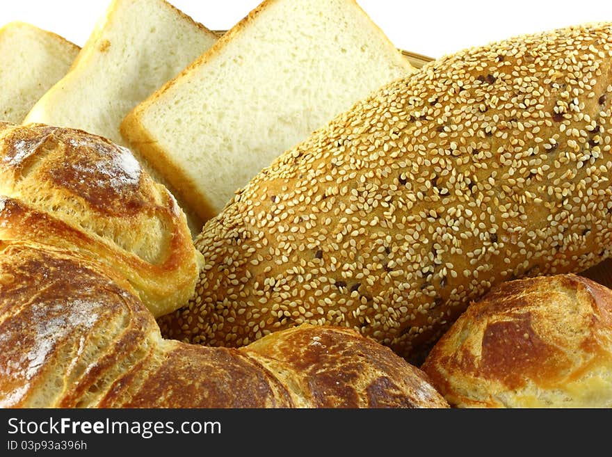 Stack of sliced whole wheat bread on isolated white background