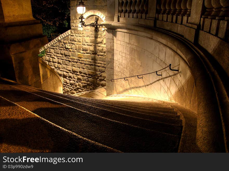 A steep staircase down into a dark night. A steep staircase down into a dark night