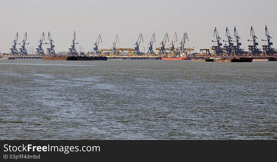 Shipyard cranes on Danube river in Galati city of Romania near Danube delta