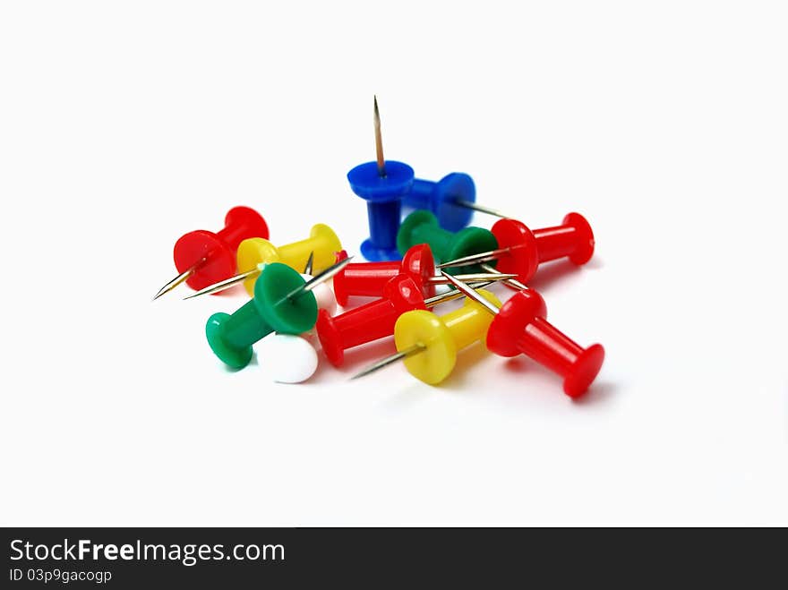 A heap of colorful pins on white background. A heap of colorful pins on white background